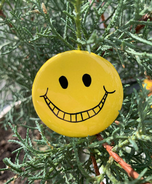 T.M.-Smiley Button